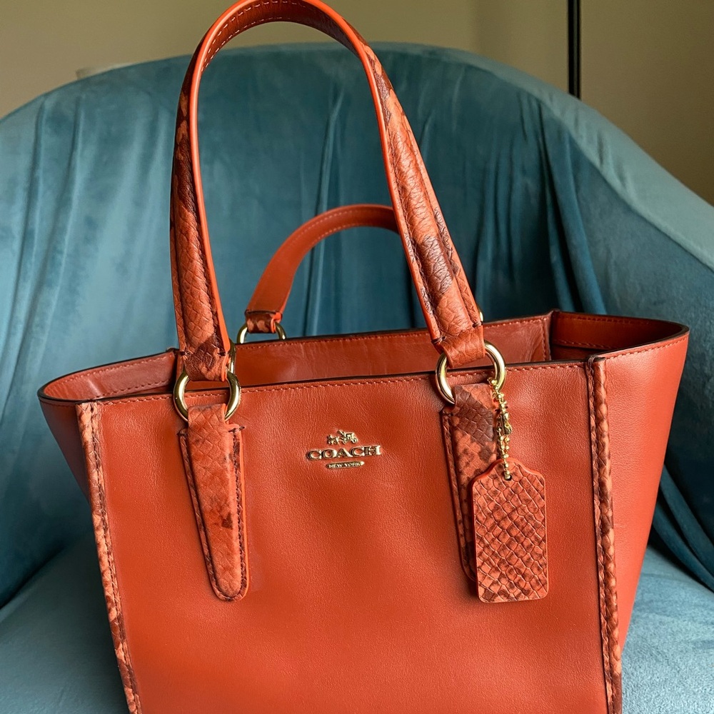 Coach purse/handbag with detachable strap. 
never used, hardware still wrapped.